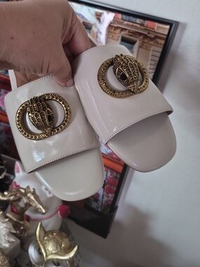 Kurt Geiger Cream Patent Slide Sandals with Gold Eagle Head